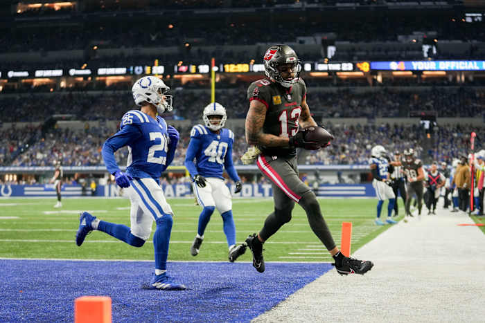 Tampa Bay Buccaneers wide receiver Mike Evans (13) runs in a touchdown Sunday, Nov. 26, 2023, during a game against the Indianapolis Colts at Lucas Oil Stadium in Indianapolis.